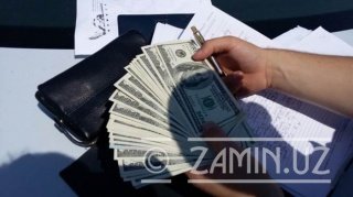 Ўзбекистонда сохта доллар сотувчилари қўлга олинди фото