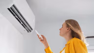What are the consequences of sitting under an air conditioner for a long time?