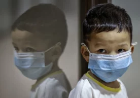 Фото: «Ezra Acayan/Getty Images» Болалар коронавирус