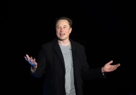 Фото: AFP/Getty Images Илон Маск ва унинг Tesla Inc ҳамда
