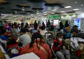 Фото: AFP Хитойда янги респиратор вирус тарқалиб,