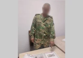 Qorako‘l tumani mudofaa bo‘limi boshlig‘i pora olayotgan