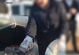 Видеодан кадр. ДХХ ер майдонларини сотаётганларни қўлга