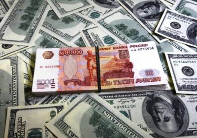 AQSh dollari kursi 59 rubldan pastga tushdi фото