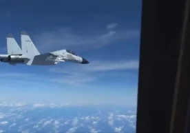 Фото: Видеодан кадр Хитой қирувчи самолёти Жанубий Хитой