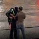 It was pouring rain. At one of the city intersections, a