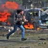 Suriyalik fotosuratchi bolani qutqarayotgan hamkasbining surati uchun 120 ming dollar oldi