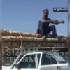 Ҳайдовчи машинасини жарима майдончасига олиб кетмасликлари учун унинг устига чиқиб олган ҳолатга ЙҲХББ муносабат билдирди