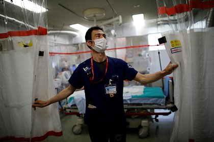 Япония ҳукумати пандемия туфайли аҳолига пул тўлайди