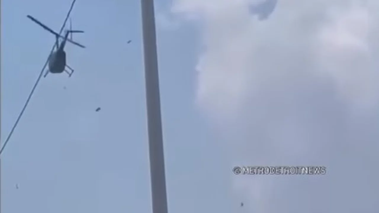 Детройтда вертолётдан сочилган пуллар ҳайрат ва баҳсларга сабаб бўлди (видео)