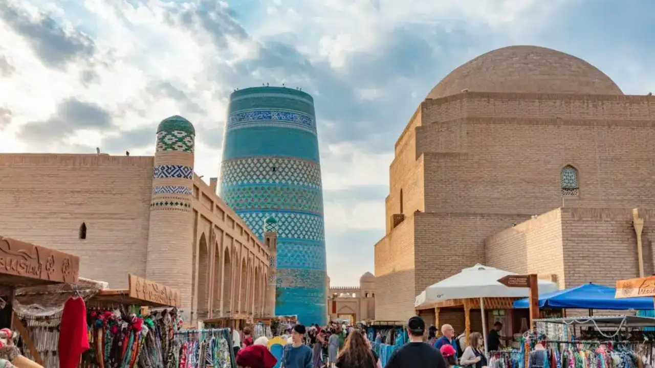 What factors increased the flow of tourists to Uzbekistan?