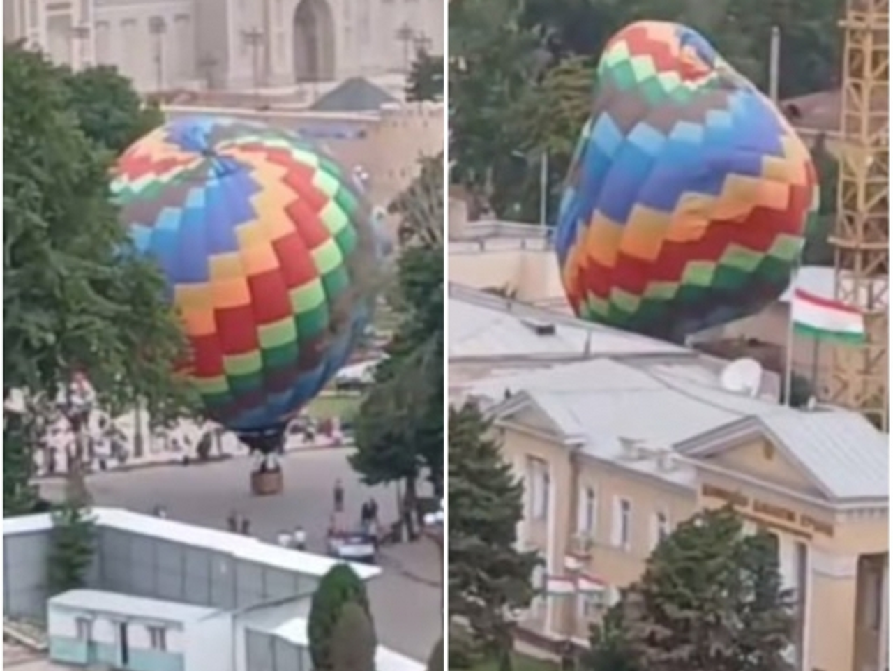 A colorful hot air balloon flying low near a building.