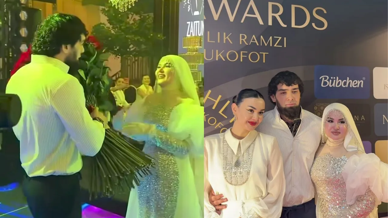 Tadbirda yigit ayolga guldasta sovg‘a qilmoqda va ular birga suratga tushishmoqda.