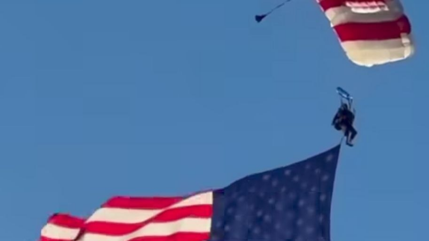 Parachutist flying with US flag crashes into crowd