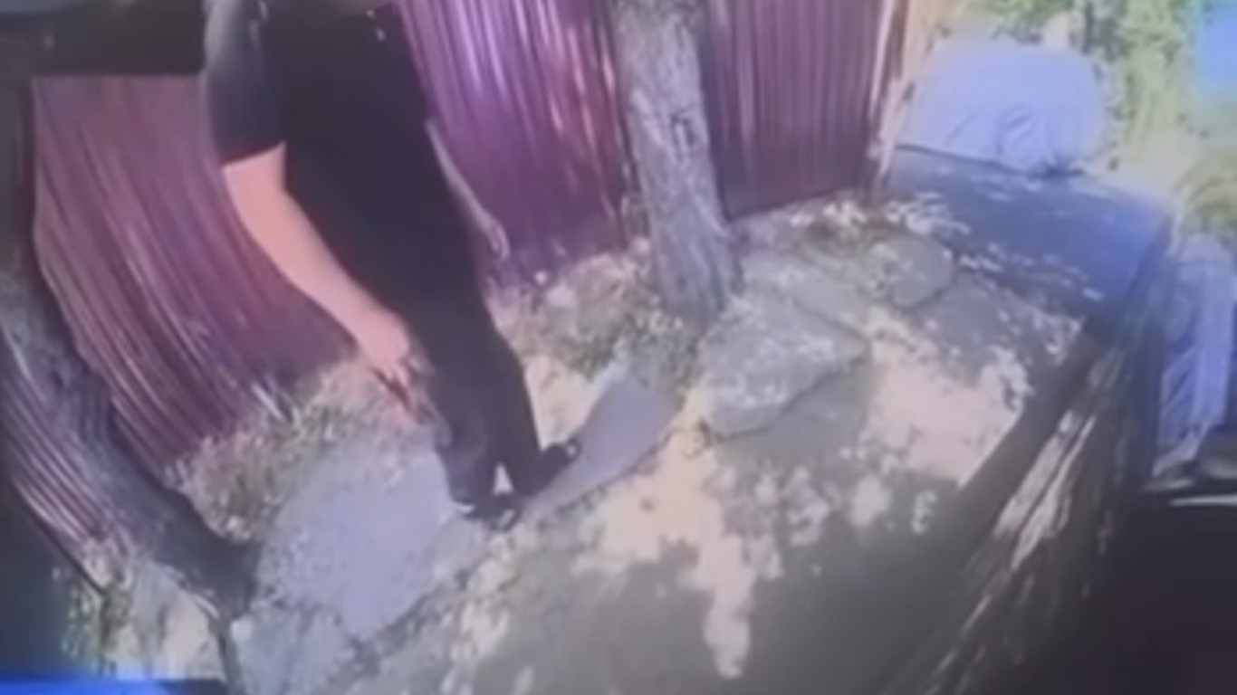 Man who scratched neighbor's car with a stone caught on camera