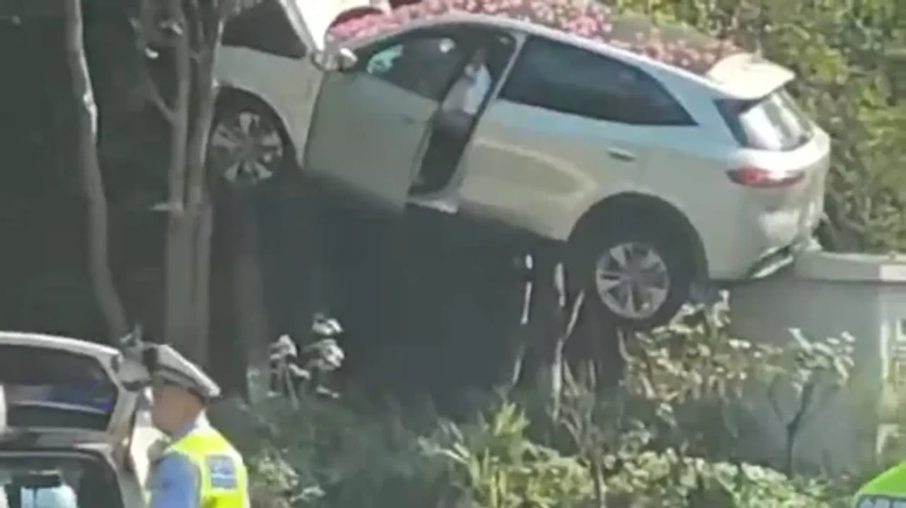 China Crash Stuns: Car Left Hanging on Cliff Face