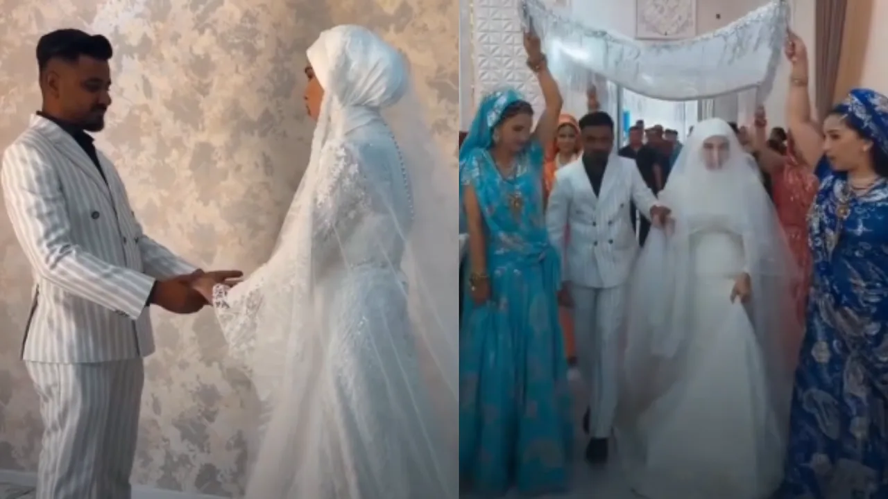 The bride and groom in white attire are taking part in the wedding ceremony.