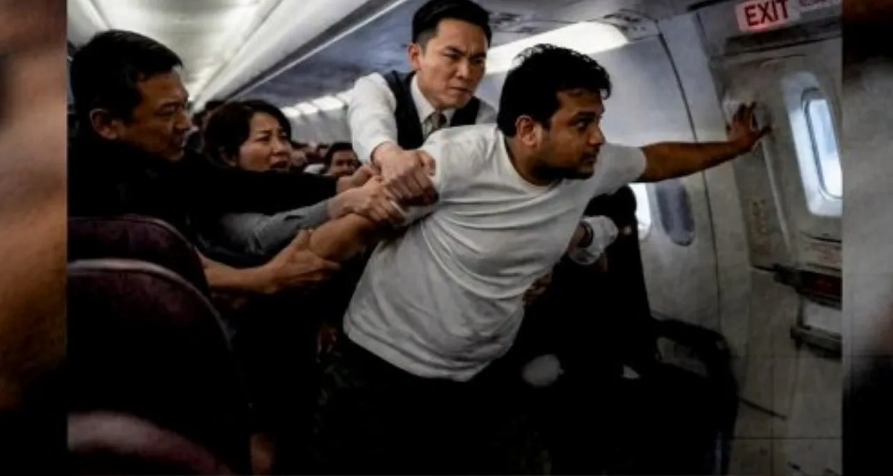Passenger Tries to Open Emergency Exit Door on Plane