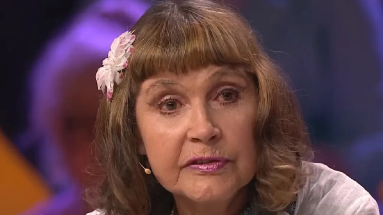 Close-up of a brown-haired woman wearing a white flower in Sochi.
