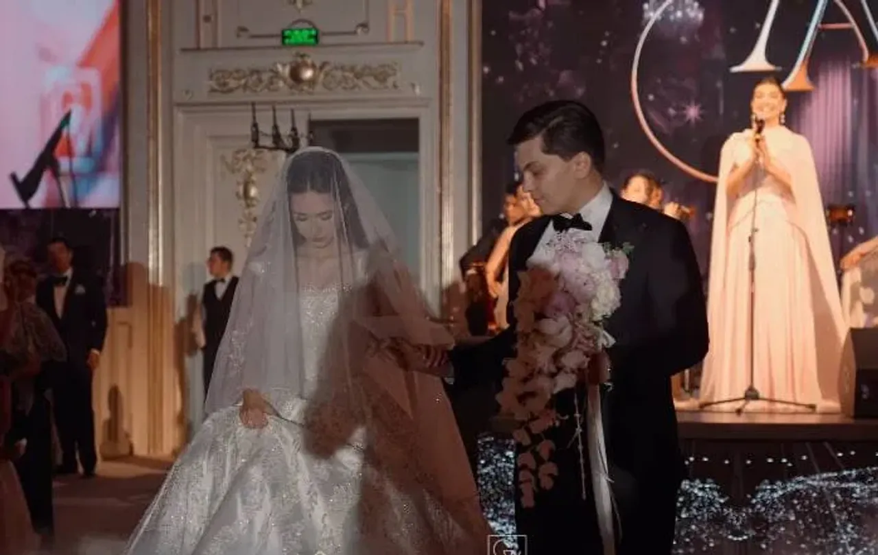 Bride and groom walking together at a solemn wedding ceremony.