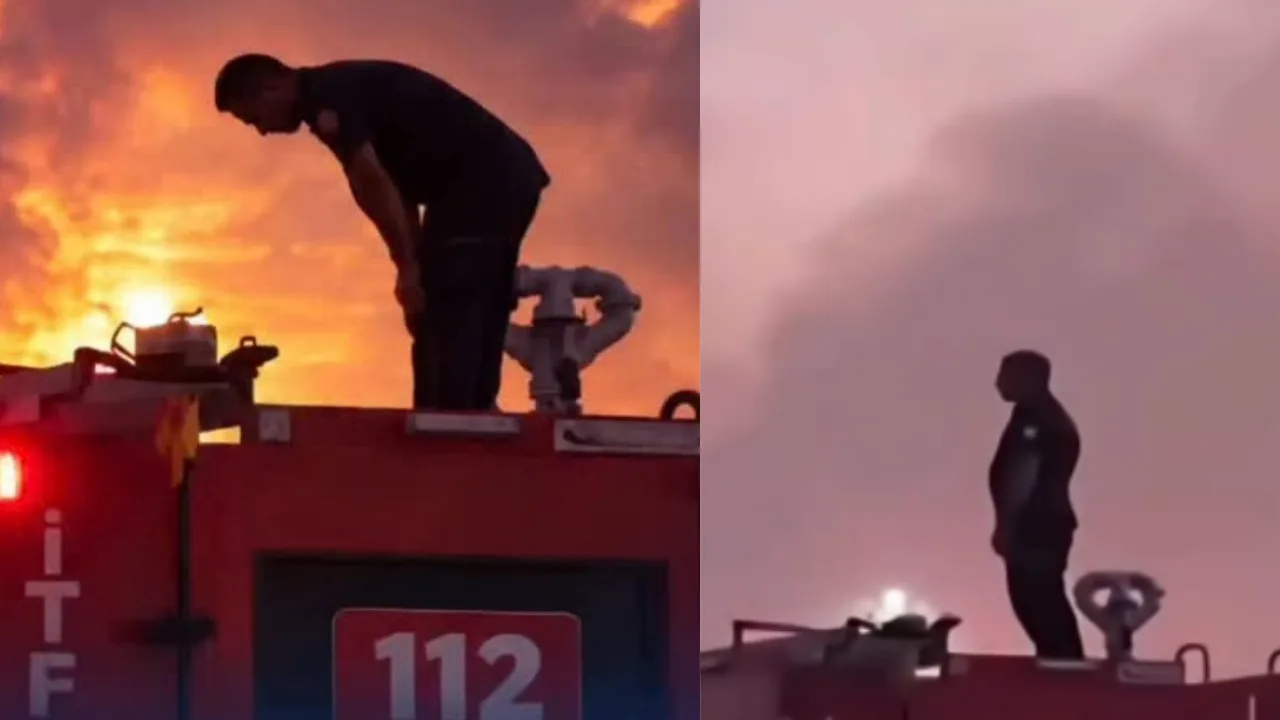 Firefighter performs prayer on top of fire truck after putting out fire