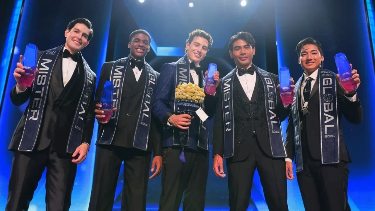 Five winners of the Mister Global 2023 contest standing on stage with their awards.