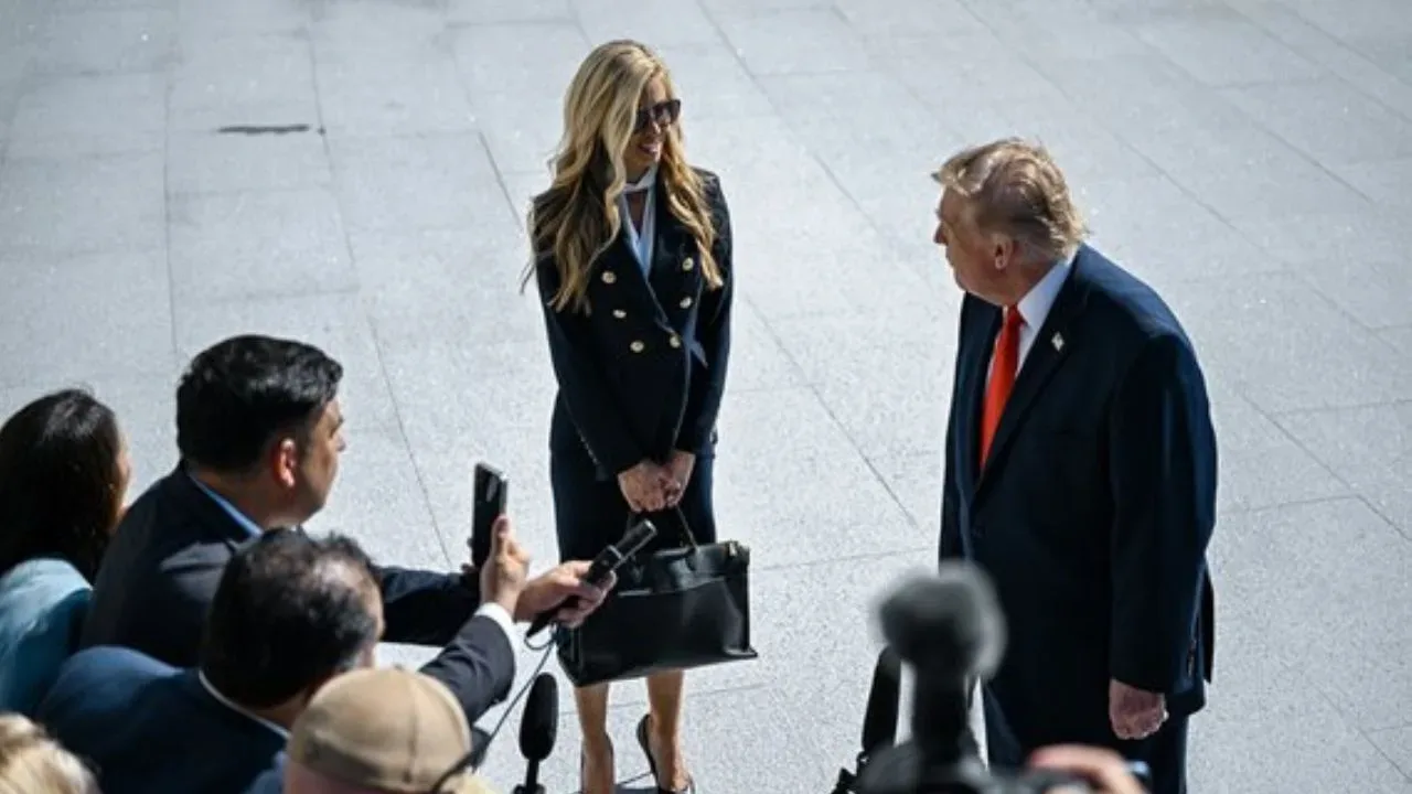 Donald Trump and his lawyer Alina Habba standing in front of journalists.